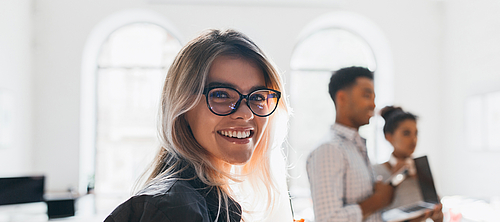 smiling people in meeting room